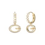 Γυναικεία σκουλαρίκια Guess Steel G Camden επίχρυσα με λογότυπο και πέτρες